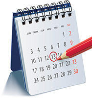 a desk calendar with a red pencil circling a date